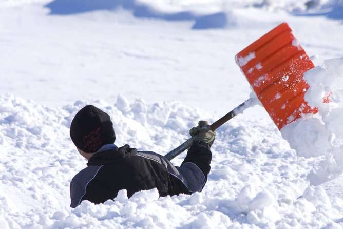 Why does shoveling snow increase risk of heart attack?