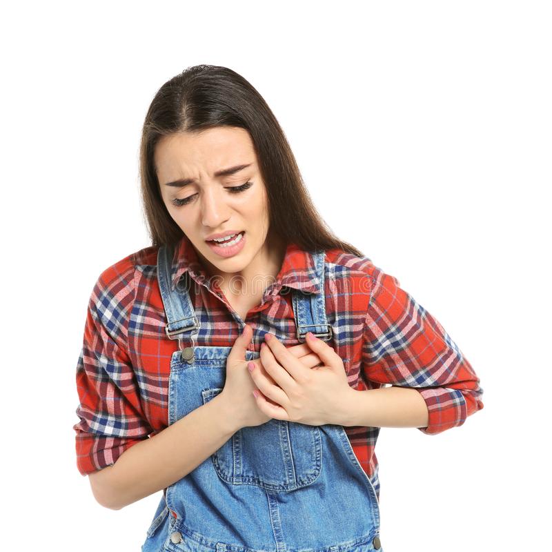 Young Woman Suffering From Heart Attack Stock Photo